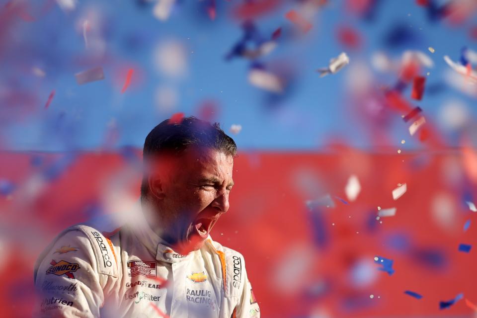 AJ Allmendinger celebrates as confetti falls in Victory Lane after winning at the Charlotte Roval on Sunday.