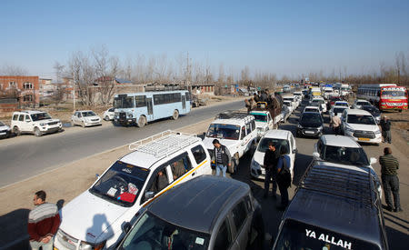 Traffic is stopped as the Indian Central Reserve Police Force (CRPF) convoy moves along a national highway in Qazigund March 18, 2019. REUTERS/Danish Ismail