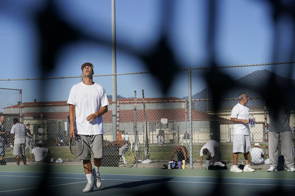 San Quentin State Prison inmate Braydon Tennison reacts after giving up a point during a tennis match against visiting players in San Quentin, Calif., Saturday, Aug. 13, 2022. (AP Photo/Godofredo A. Vásquez)