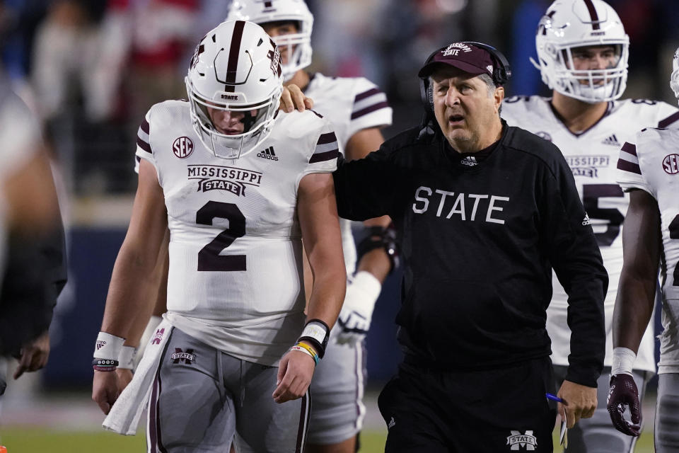 Mississippi State coach Mike Leach confers with quarterback Will Rogers during the first half of the team's NCAA college football game against Mississippi in Oxford, Miss., Thursday, Nov. 24, 2022. / Credit: Rogelio V. Solis / AP