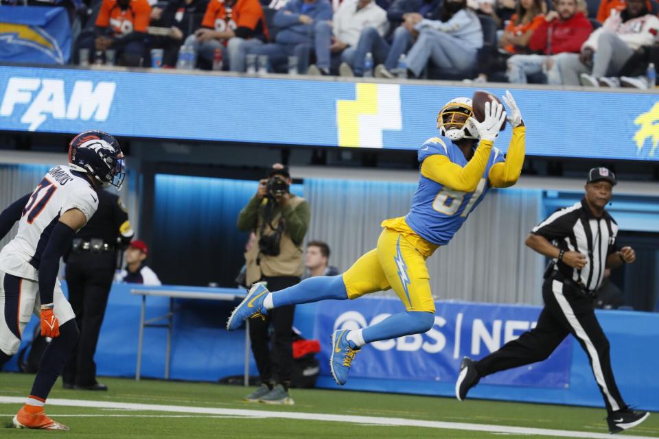 Mike Williams (81) hauls in a 45-yard TD pass from Chargers quarterback Justin Herbert in the fourth quarter against Denver.