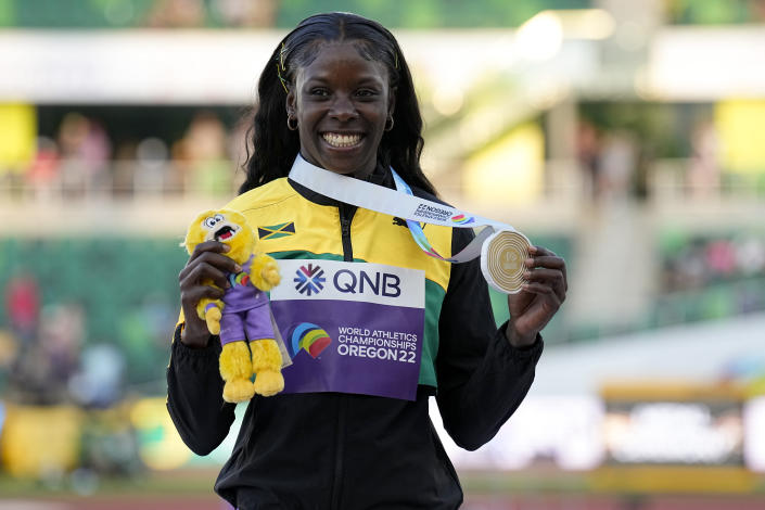 Gold medalist Shericka Jackson, of Jamaica, poses during a medal ceremony for the women's 200-meter run at the World Athletics Championships on Thursday, July 21, 2022, in Eugene, Ore. (AP Photo/Gregory Bull)