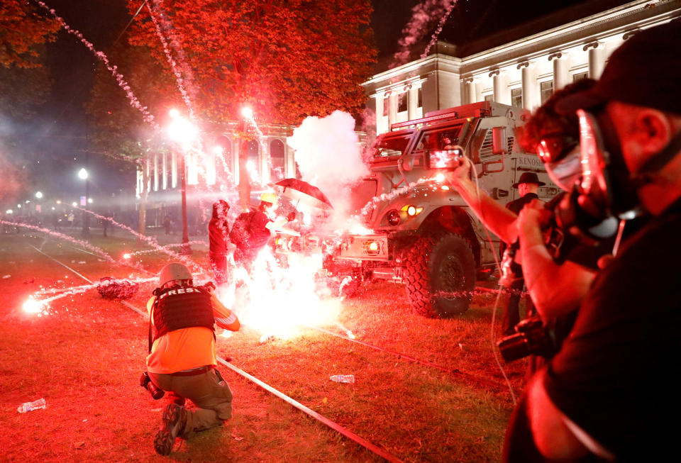 Flares go off in front of a Kenosha County Sheriff vehicle