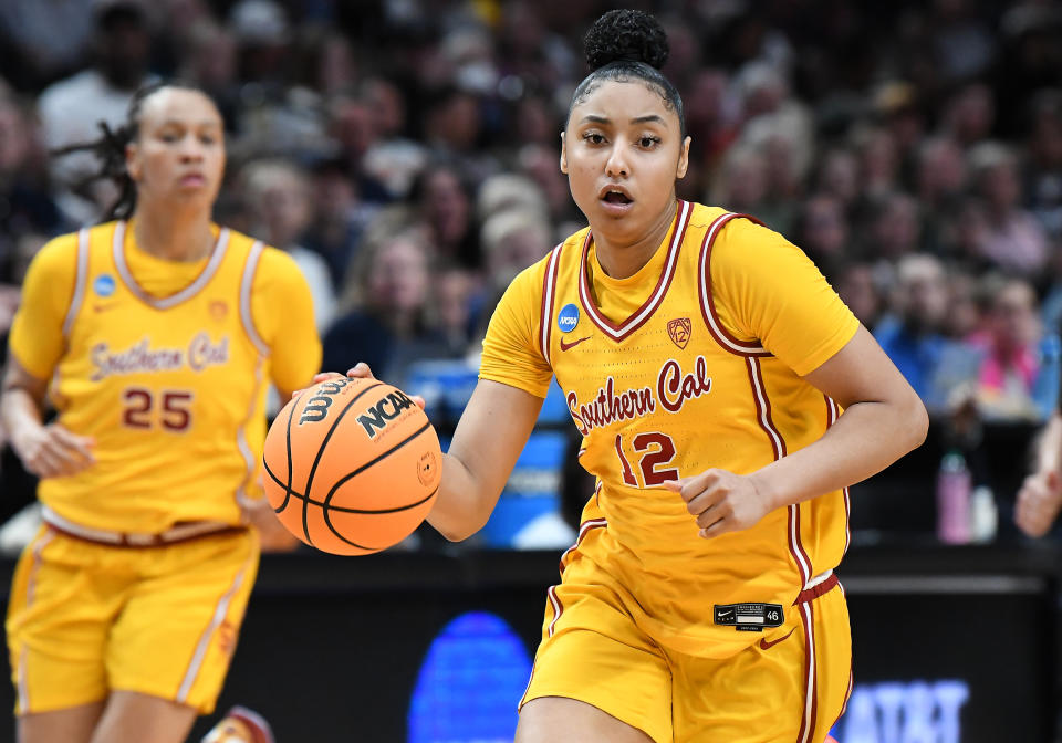 PORTLAND, OR - APRIL 01:  USC Trojans guard JuJu Watkins (12) controls the ball during a 2024 Div I Women's Basketball Championship Elite Eight game between the UConn Huskies and USC Trojans on April 1, 2024 at Moda Center in Portland, Oregon. (Photo by Brian Murphy/Icon Sportswire via Getty Images)