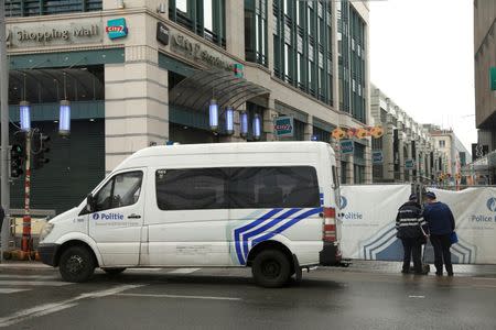 Police stand outside the blocked-off street outside the City2 shopping complex which was evacuated following a bomb scare in Brussels, Belgium, June 21, 2016. REUTERS/Francois Lenoir