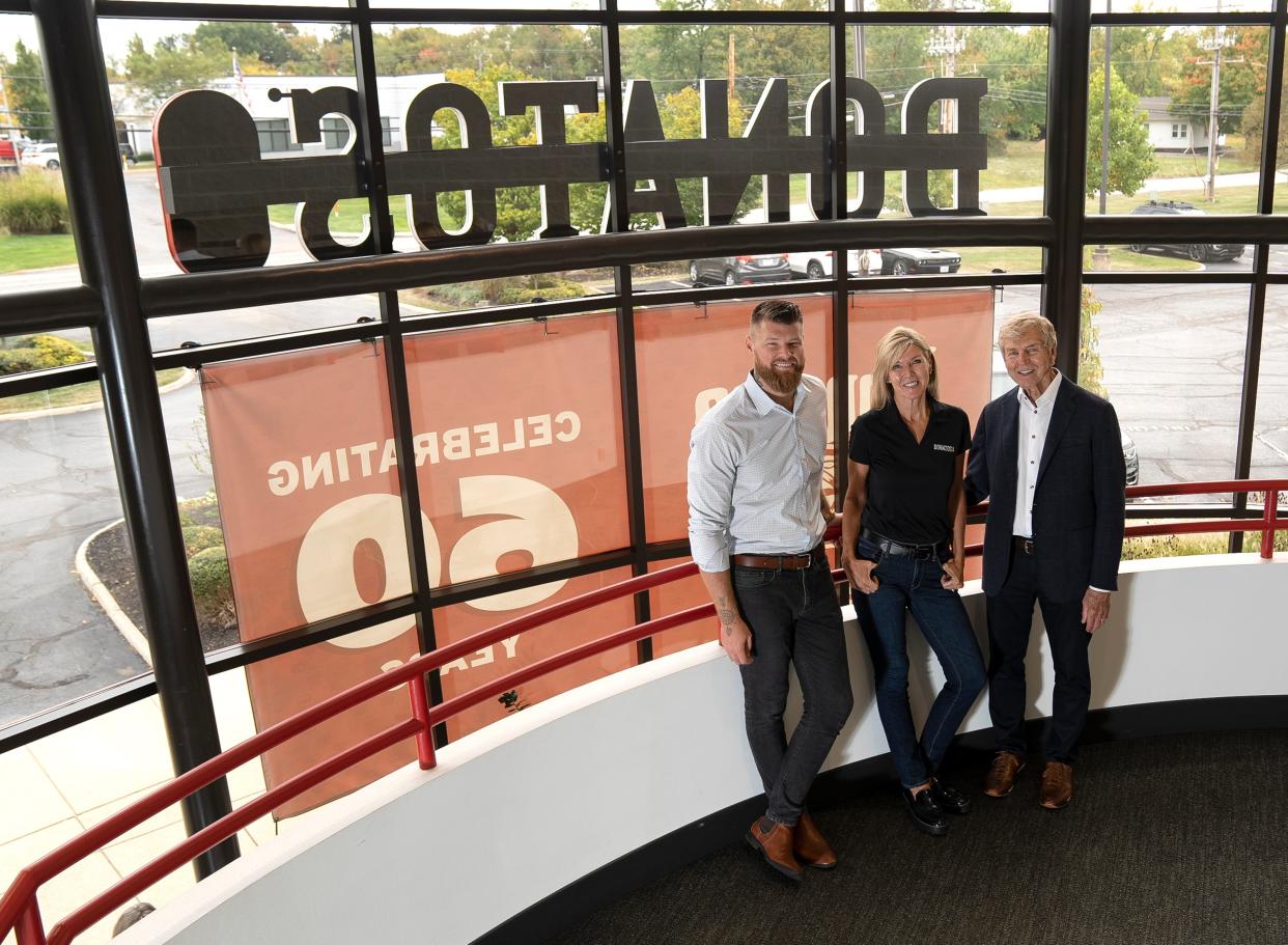 Donato's leadership pictured in the entryway of the company's home office (from left): Tony Capuano, vice president of franchise operations and son of Jane Grote Abell; Jane Grote Abell, executive chairwoman of the board and chief purpose officer; and Jim Grote, founder.