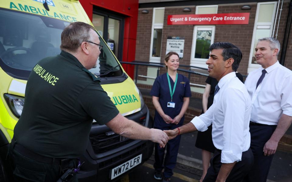 Rishi Sunak, the Prime Minister, shakes hands with an ambulance drive this morning during a visit to University Hospital of North Tees - Phil Noble/Reuters 