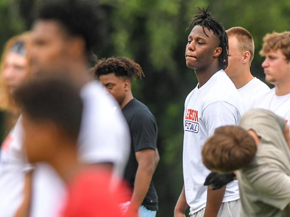 Trevor Etienne, right, of Jennings, La., younger brother of Travis Etienne, stands with running backs during Dabo Swinney Football Camp 2021 day one in Clemson Wednesday, June 2, 2021.