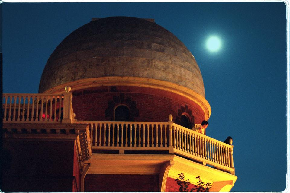The moon shines over Brown University's Ladd Observatory in Providence, which is closed temporarily due to the pandemic.