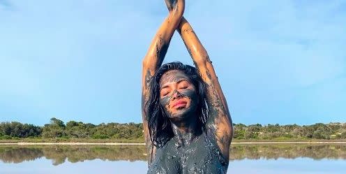 Nicole Scherzinger looks basically naked in mud covered pics