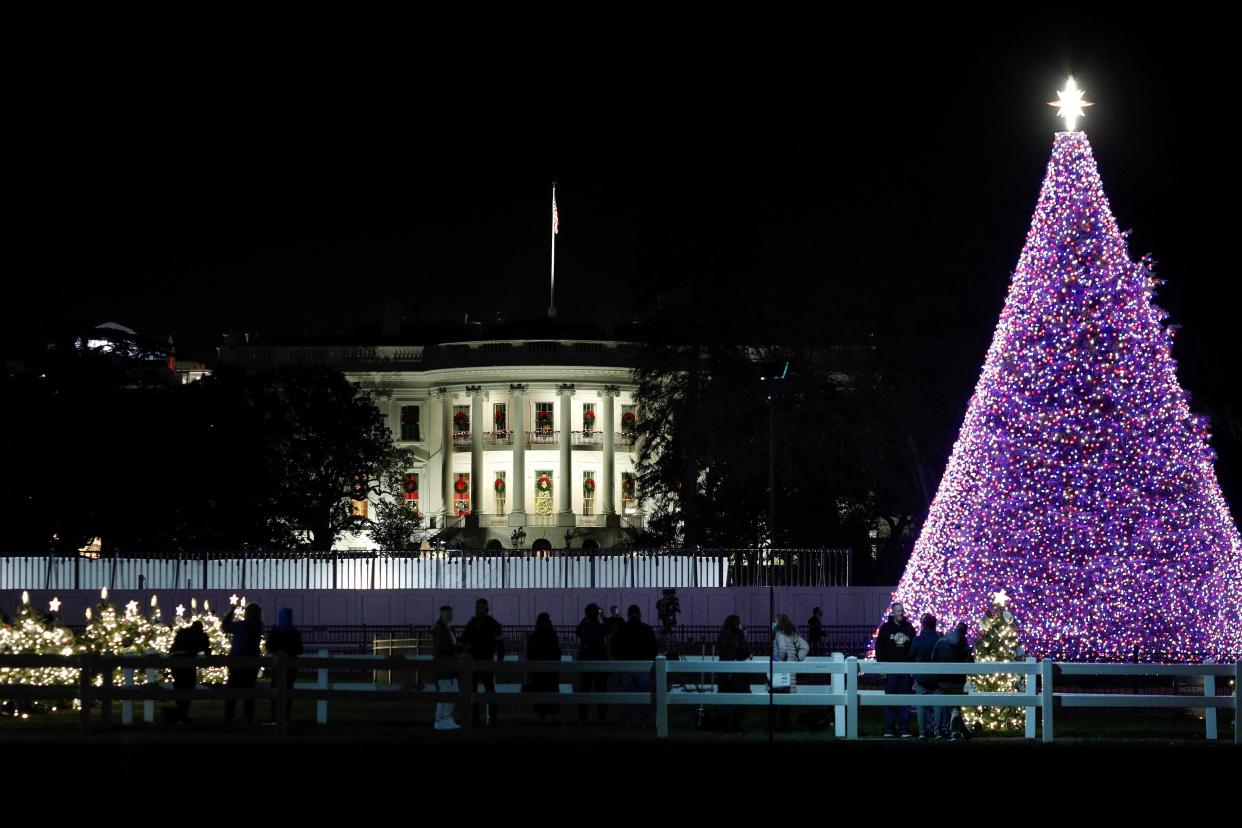 <p>The National Christmas Tree is illuminated outside of the White House.</p> (REUTERS)