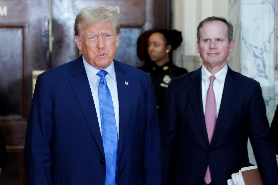 Former President Donald Trump speaks before entering the courtroom at New York Supreme on Monday.