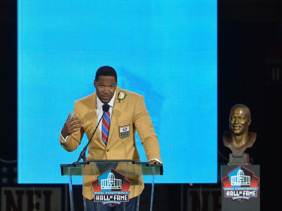 Michael Strahan speaks after his induction into the Pro Football Hall of Fame.