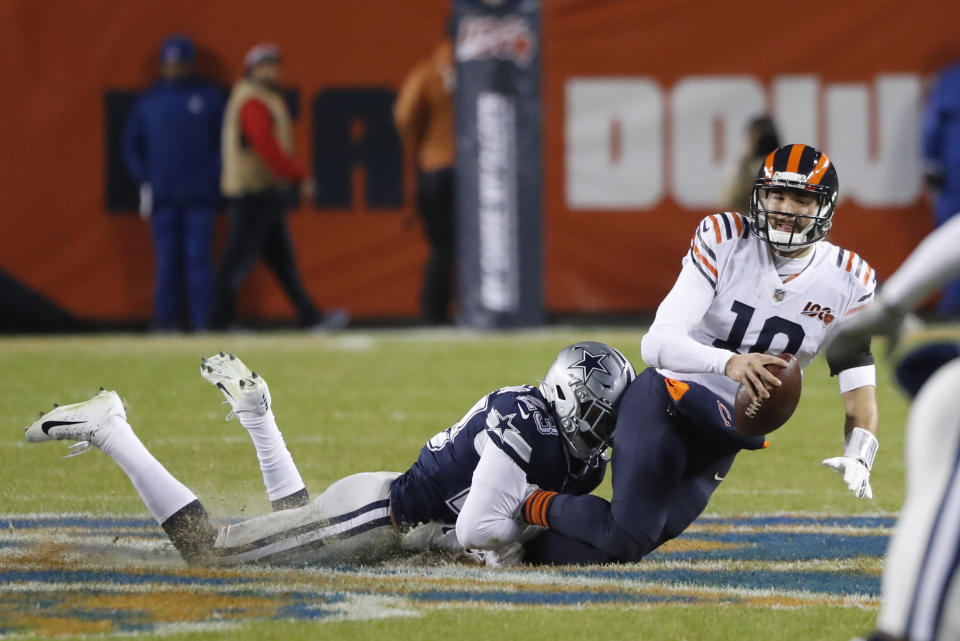 Chicago Bears quarterback Mitchell Trubisky (10) is sacked by Dallas Cowboys' Darian Thompson (23) during the first half of an NFL football game, Thursday, Dec. 5, 2019, in Chicago. (AP Photo/Charles Rex Arbogast)