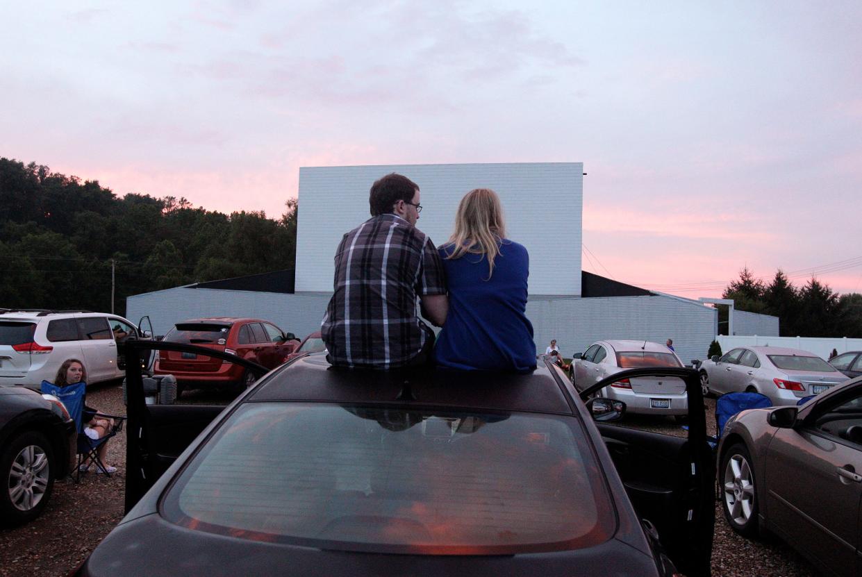 Visitors watch the sunset while waiting for the movie to start at the Skyview Drive-In theater in Lancaster in this 2013 file photo.