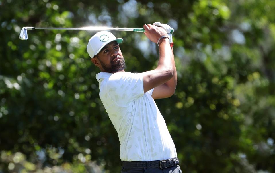 Tony Finau hitting his tee shot on the fourth tee