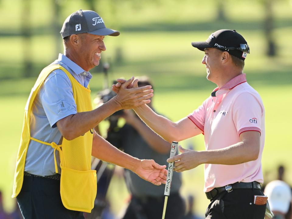 Justin Thomas celebrates with caddie Jim "Bones" Mackay after winning the 2022 PGA Championship.