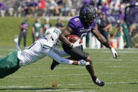 Northwestern wide receiver Malik Washington, right, is tackled by Ohio safety Tariq Drake during the first half of an NCAA college football game in Evanston, Ill., Saturday, Sept. 25, 2021. (AP Photo/Nam Y. Huh)