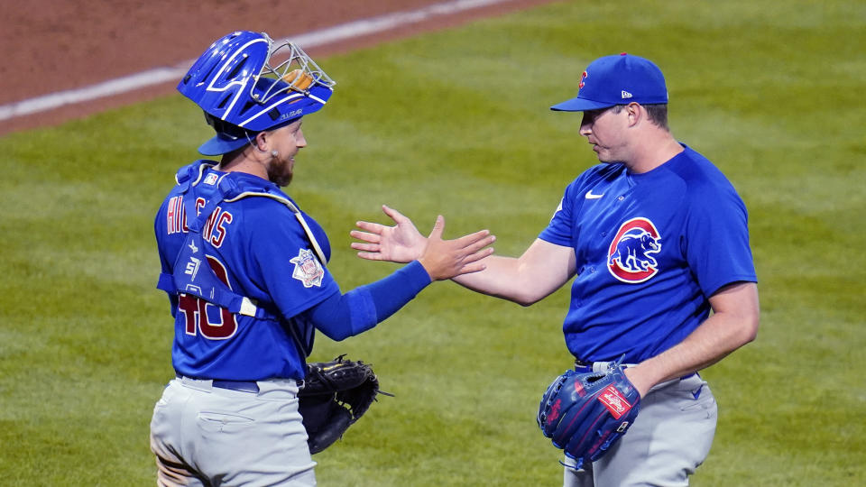 Chicago Cubs relief pitcher Erich Uelmen, right, celebrates with catcher P.J. Higgins after getting the final out of a baseball game against the Pittsburgh Pirates in Pittsburgh, Friday, Sept. 23, 2022. (AP Photo/Gene J. Puskar)