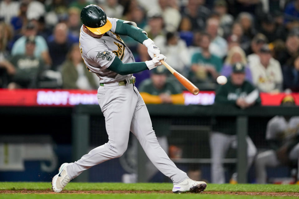 Oakland Athletics' Brent Rooker hits a single against the Seattle Mariners during the eighth inning of a baseball game Tuesday, Aug. 29, 2023, in Seattle. (AP Photo/Lindsey Wasson)