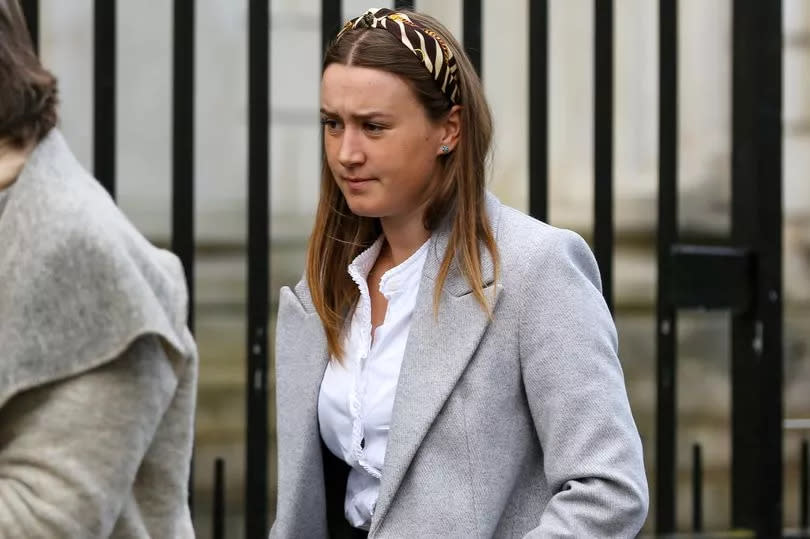 Rose De Montgomery-Wright at Derry Court on Friday in a white blouse and grey coat with long dark hair