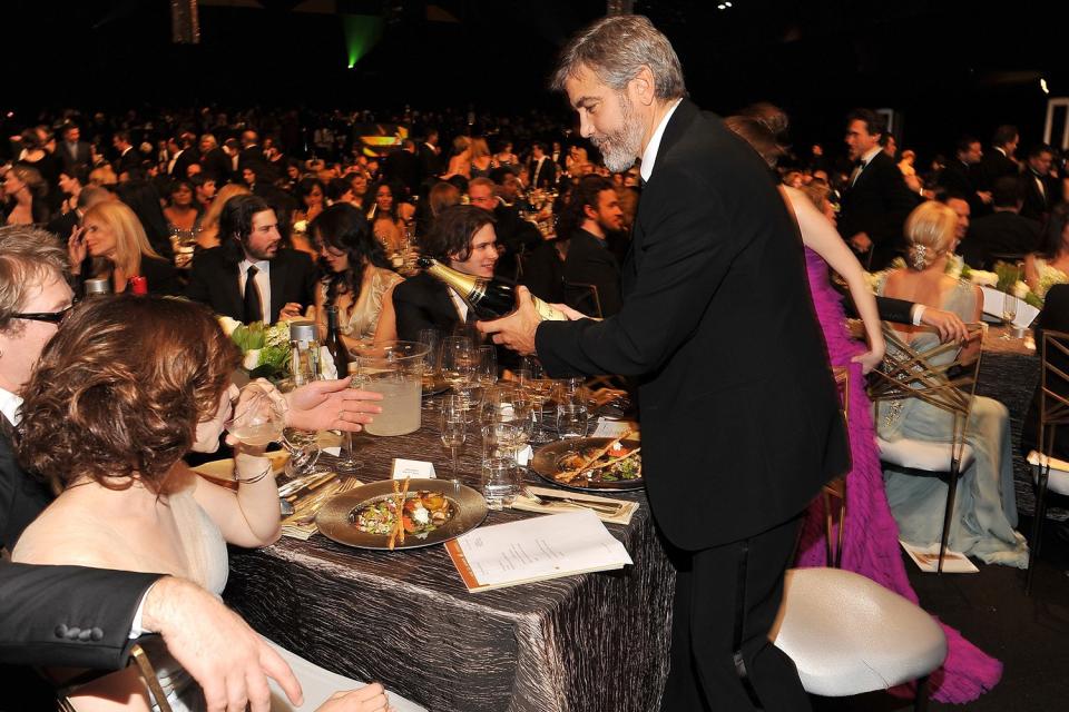 George Clooney popped some champagne for his table. 