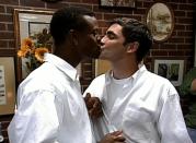 <p>Pedro Zamora (right) was the first openly-gay, HIV-positive man to appear on television—on MTV's <em>The Real World: San Francisco.</em> The show captured a commitment ceremony between Zamora and his partner, Sean Sasser, marking the first time a same-sex ceremony of any kind had appeared on national television. Zamora passed away hours after the finale of the season aired in 1994 and is remembered as a key player in shifting how members of the LGBTQ+ community living with HIV and AIDS were perceived nationwide.</p>