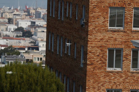 A drone flies next to the Consulate General of Russia building in San Francisco, California, U.S., September 2, 2017. REUTERS/Stephen Lam