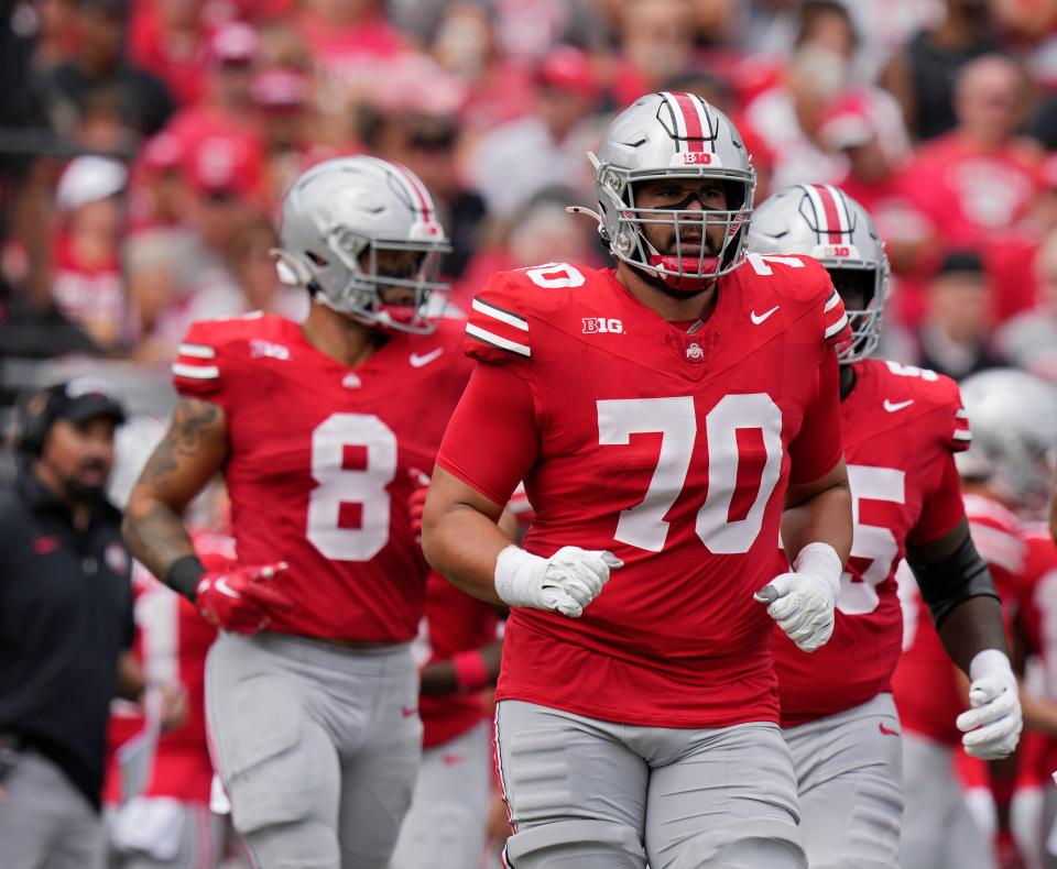 Sept. 9, 2023; Columbus, Oh., USA;  Ohio State Buckeyes offensive lineman Josh Fryar (70) takes the field during the first half of Saturday's NCAA Division I football game against the Youngstown State Penguins at Ohio Stadium. 