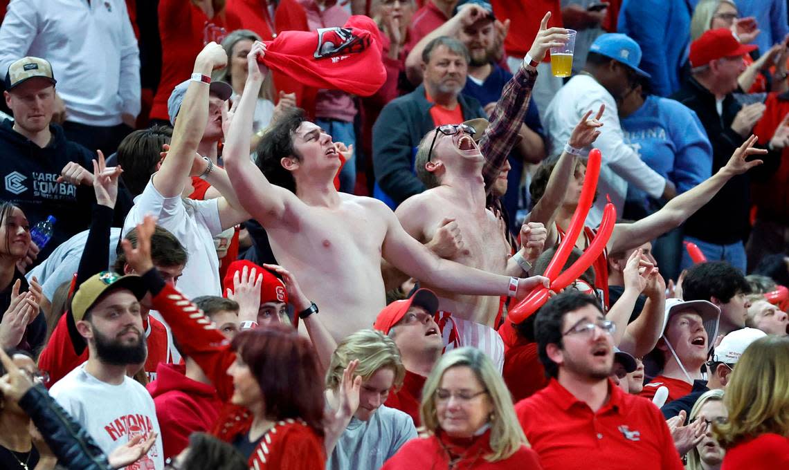 Wolfpack fans celebrate in the second half of N.C. State’s 77-69 victory over UNC at PNC Arena in Raleigh, N.C., Sunday, Feb. 19, 2023.