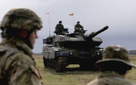 Polish army soldiers wait for the U.S.-led NATO deployment welcoming ceremony at polygon near Orzysz, Poland, April 13, 2017. REUTERS/Kacper Pempel