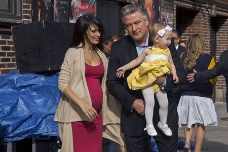 Alec and Hilaria Baldwin depart Ed Sullivan Theater with their daughter Carmen in Manhattan after taking part in the taping of tonight's final edition of "The Late Show" with David Letterman in New York May 20, 2015. REUTERS/Lucas Jackson
