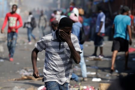 Demonstrators march during a protest to demand the resignation of Haitian president Jovenel Moise, in the streets of Port-au-Prince