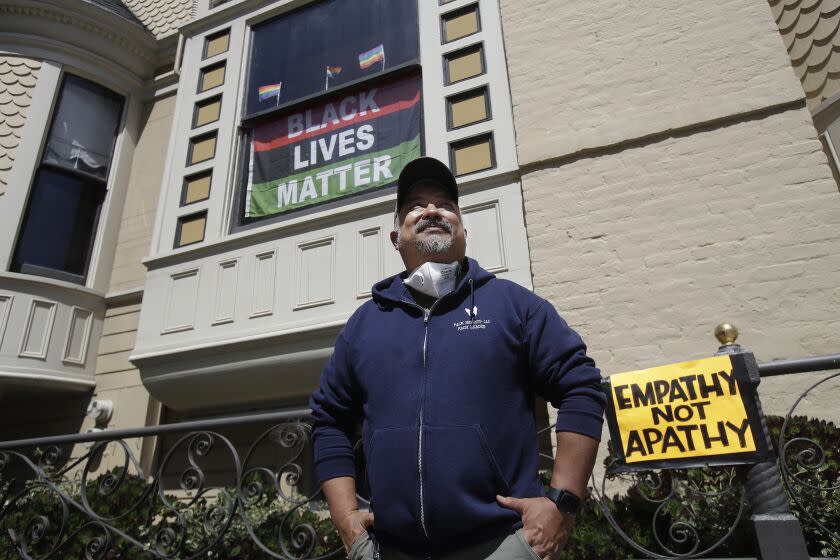 FILE - In this June 14, 2020, file photo, James Juanillo poses outside of his home in San Francisco.