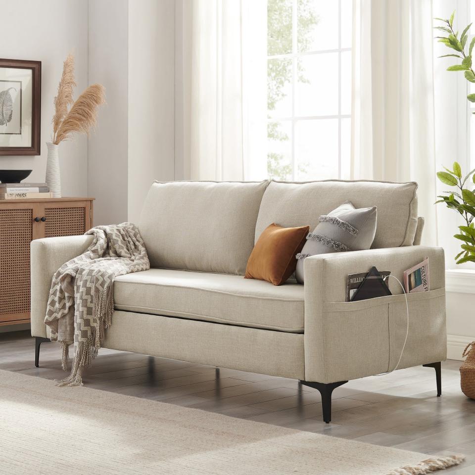 <p>The <span>Hillsdale Larissa Sofa</span> ($357, originally $459) is a brilliant option for multitaskers because it comes with not one but two USB ports under each arms plus storage pockets to fit tablets, magazines, you name it. It doesn't come in any bold colors, but rather, three timeless neutrals: beige, black, and light gray. </p><p><strong>What we love:</strong> </p> <ul> <li>We love the built-in conveniences of this sofa.</li> <li>No tools are required when it comes to assembly.</li> </ul> <p><strong>Who it's best for:</strong> </p><ul> <li>This sofa is a great choice if you're looking for a chic, neutral-colored option under $500.</li> <li>It's great for those who want the convenience of storage pockets and USB ports.</li> </ul> <p><strong>Who should avoid it:</strong></p> <ul> <li>Even though no tools are required for assembly, the brand recommends having two people put it together, so this may be worth considering before adding it to your shopping cart.</li> </ul> <p><strong>The Details:</strong> <strong>Width: </strong>75" | <strong>Height:</strong> 34.25" | <strong>Depth: </strong>32.50" | <strong>Upholstery:</strong> Polyester| <strong>Color Options:</strong> 3</p>