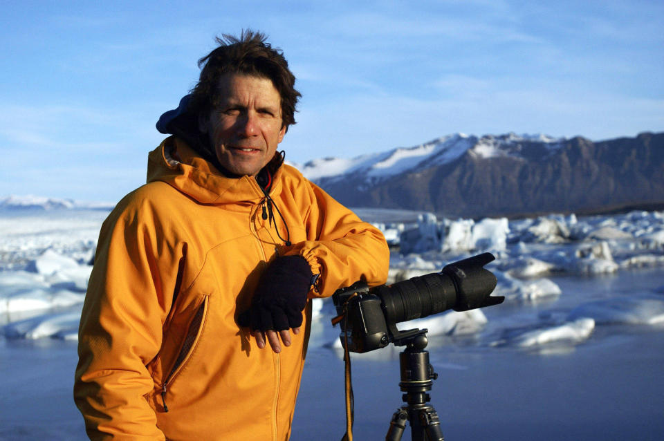 This 2005 photo released by Extreme Ice Survey shows National Geographic photographer James Balog in Iceland during the filming of "Chasing Ice." The film, about climate change, follows National Geographic photographer James Balog across the Arctic as he deploys revolutionary time-lapse cameras designed to capture a multi-year record of the world's changing glaciers. (AP Photo/Extreme Ice Survey)