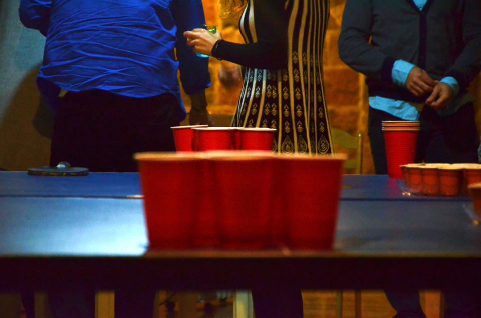 A table with red party cups on it.