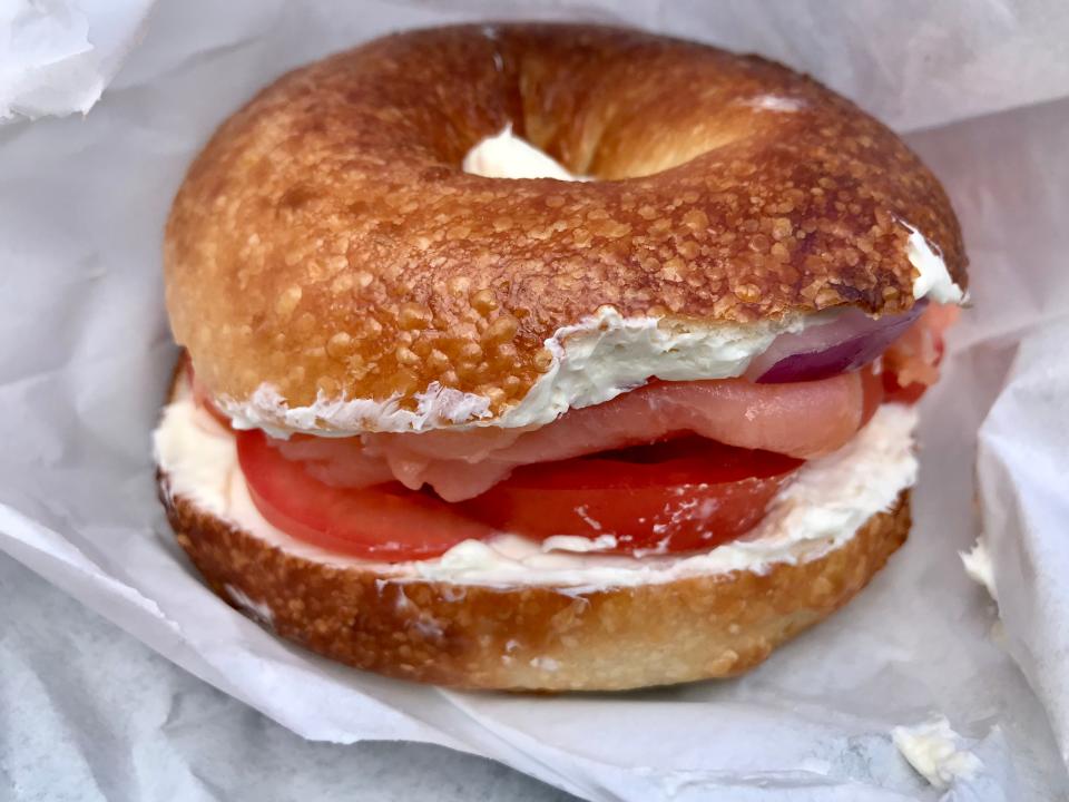 Ruby's Bagels starts with its own hand-rolled bagel and puts fresh dill and juicy tomato slices along with red onion and capers on its Full Lox sandwich.