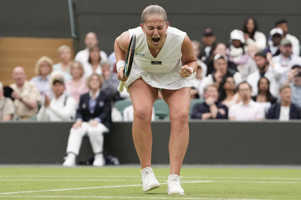 Jelena Ostapenko of Latvia celebrates after defeating Yulia Putintseva of Kazakhstan in during their fourth round match at the Wimbledon tennis championships in London, Monday, July 8, 2024. (AP Photo/Alberto Pezzali)