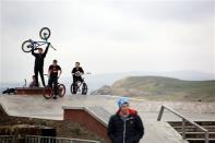 Boys play at a skate park in the town of Lerwick on the Shetland Islands April 3, 2014. REUTERS/Cathal McNaughton