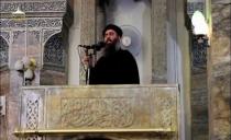 FILE PHOTO: A man purported to be the reclusive leader of the militant Islamic State Abu Bakr al-Baghdadi making what would have been his first public appearance, at a mosque in the centre of Iraq's second city, Mosul, according to a video recording posted on the Internet on July 5, 2014, in this still image taken from video. REUTERS/Social Media Website via Reuters TV/File Photo ATTENTION EDITORS - THIS IMAGE HAS BEEN SUPPLIED BY A THIRD PARTY. REUTERS IS UNABLE TO INDEPENDENTLY VERIFY THE CONTENT OF THIS VIDEO, WHICH HAS BEEN OBTAINED FROM A SOCIAL MEDIA WEBSITE