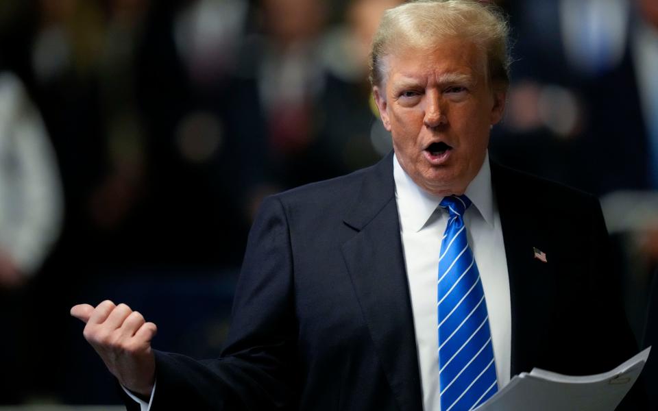 Donald Trump speaks to members of the media upon arriving at Manhattan criminal court