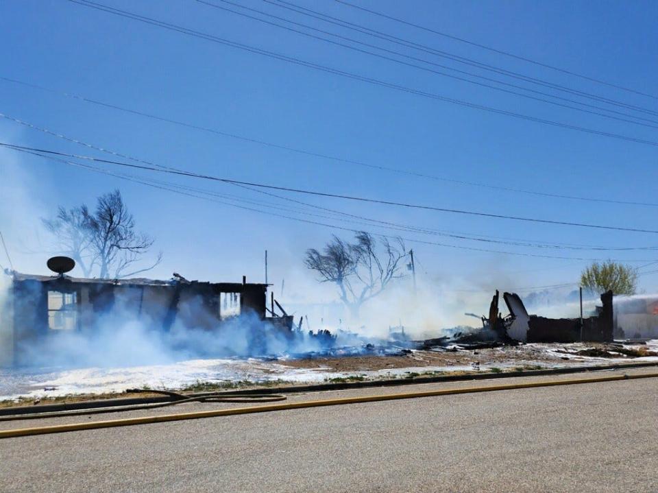 Amarillo firefighters battle a fire involving two structures near NW 3rd and N Jefferson near downtown Amarillo on Friday afternoon.