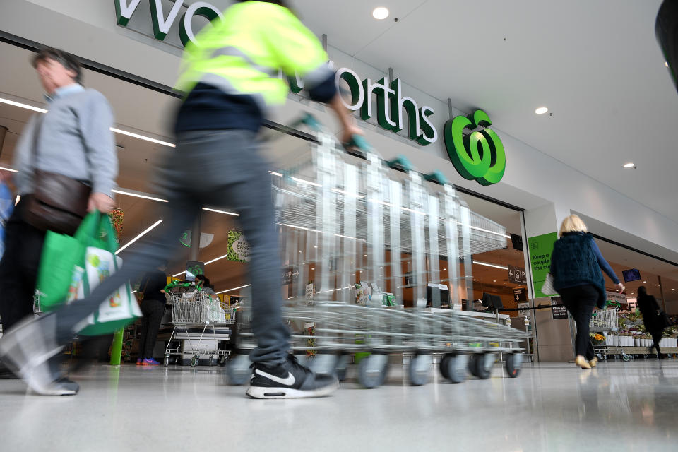 Cleaning trolleys regularly is among Woolworths' ramped up cleaning regime. Source: AAP