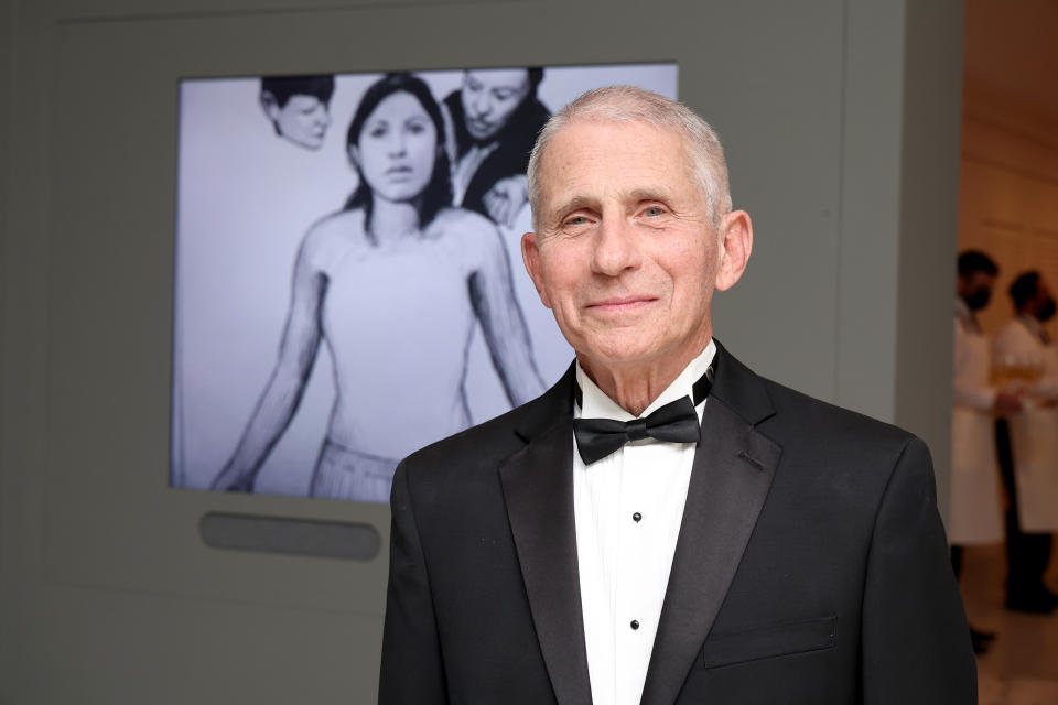 Anthony Fauci in front of Hugo Crosthwaite’s work at the 2022 Portrait Of A Nation Gala.