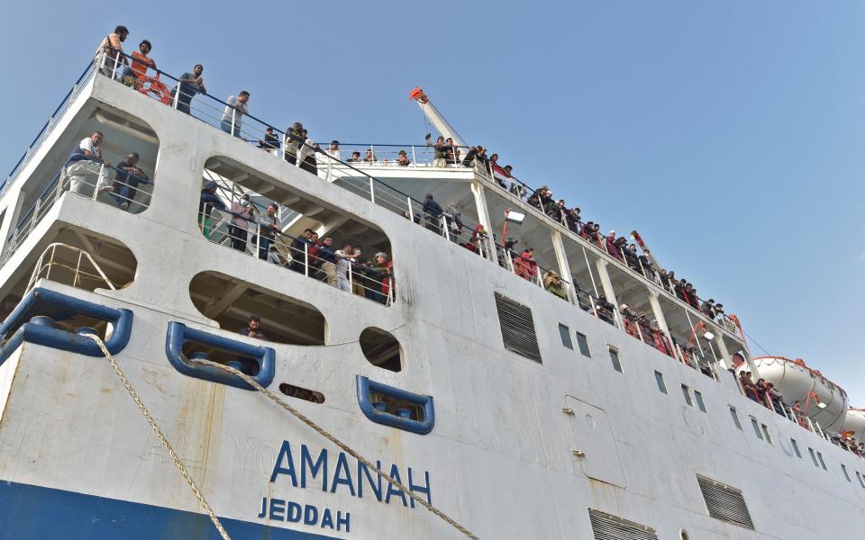 A boat with 1,687 civilians from more than 50 countries fleeing violence in Sudan, arrive at King Faisal navy base - AMER HILABI