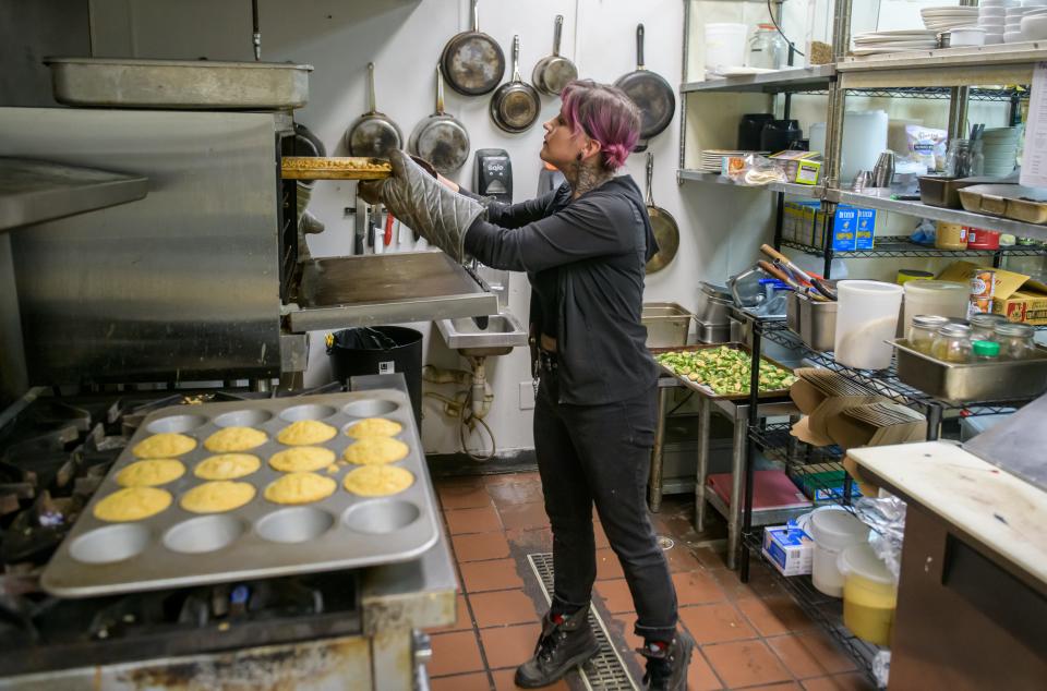 Jam Rohr, owner of Radish Kitchen, works on the lunch menu in the vegan restaurant in the Campustown Shopping Center in Peoria.