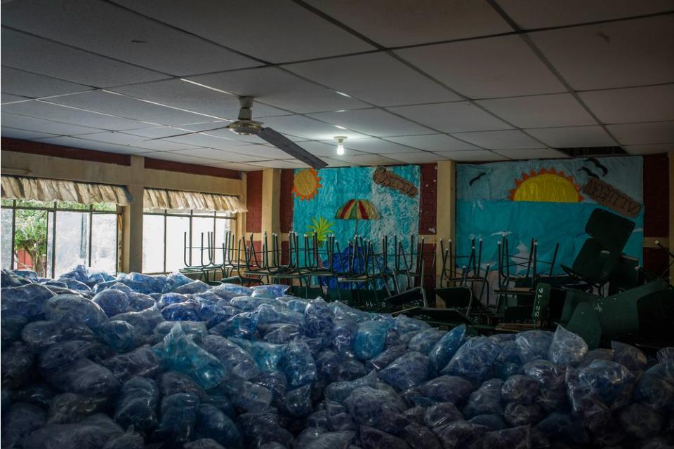 Packages of water fill a room at a shelter in Escuintla on June 4.