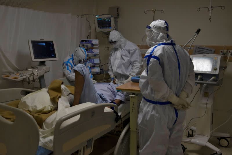 Medical workers treat patients infected with the coronavirus disease (COVID-19) at a hospital in New Delhi