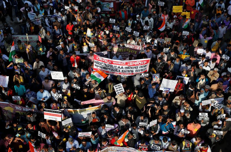 Demonstrators carrying banners and placards attend a protest march against the National Register of Citizens and a new citizenship law, in Kolkata